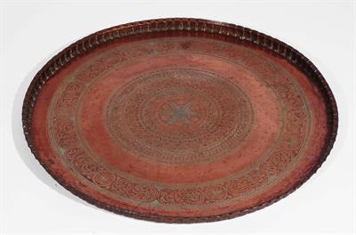 Lot 657 - A large Persian copper tray