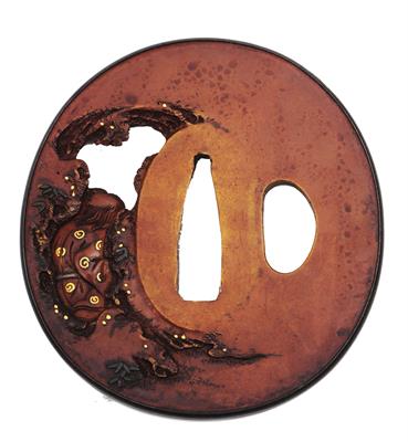 Lot 677 - A Japanese tsuba