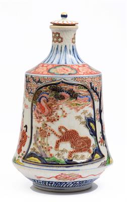 Lot 696 - A Japanese Imari sake flask and cover