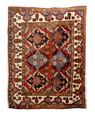 Lot 704 - A Baluch red ground rug