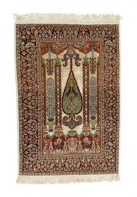 Lot 710 - A Persian ivory ground prayer rug
