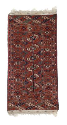 Lot 712 - A Turkoman red ground mat
