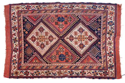Lot 717 - An Afshar cream ground rug