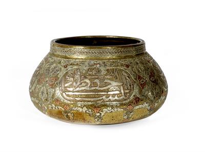 Lot 730 - A Mamluk brass and inlaid bowl