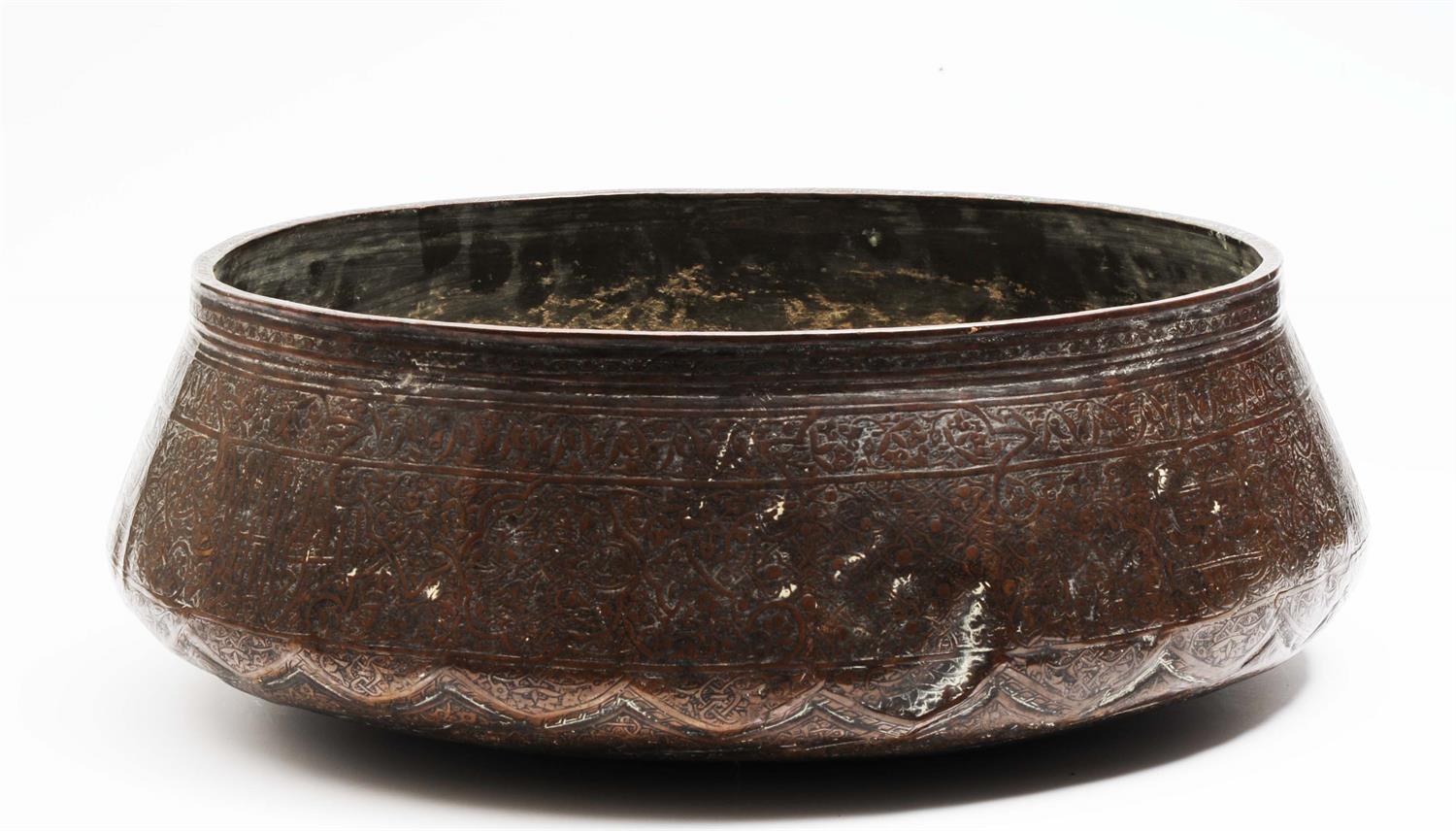 Lot 784 - A Persian Mamluk brass engraved bowl