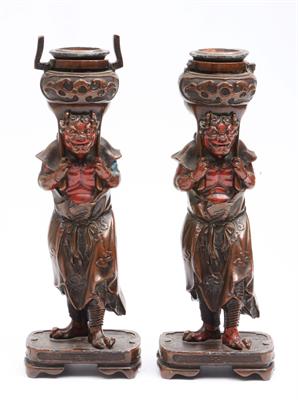 Lot 805 - A pair of Japanese bronze metal candlesticks