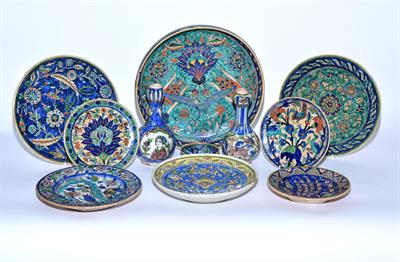 Lot 818 - A pair of Persian Qajar garlic neck bottle vase