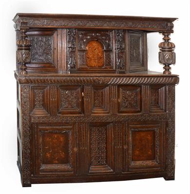 Lot 31 - A 17th Century style carved oak court cupboard