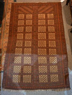 Lot 38 - A Baluch brick-red rug
