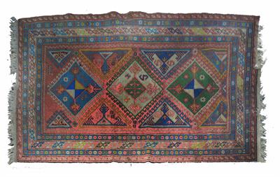 Lot 64 - A Caucasian red (faded) ground rug