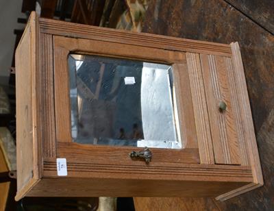 Lot 75 - An Edwardian oak bathroom cupboard