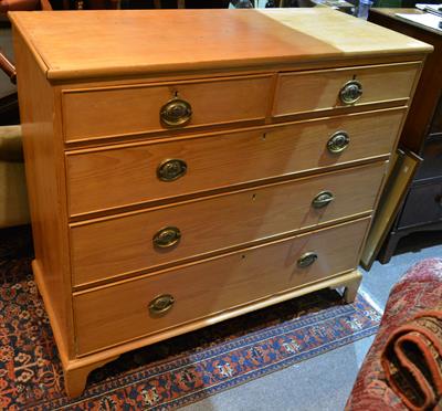 Lot 107 - A George III pine straight front chest of two short and three long drawers