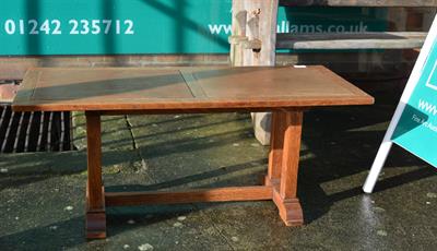 Lot 113 - An Arts & Crafts oak refectory style coffee table