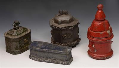 Lot 275 - A green painted lead tobacco jar