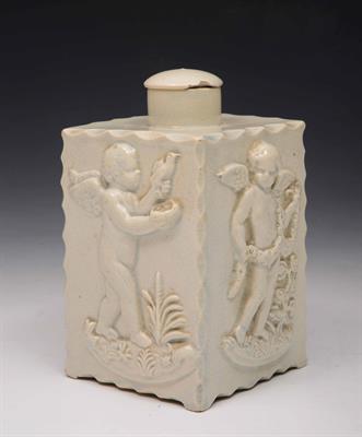 Lot 293 - An English creamware square tea caddy and cover