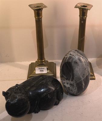 Lot 306 - A pair of George III brass column candlesticks