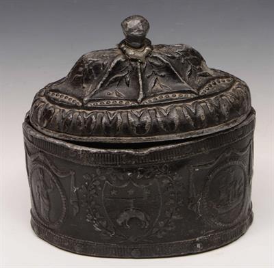 Lot 310 - A lead tobacco jar