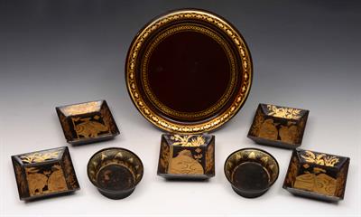 Lot 313 - A set of five 19th Century black lacquer small trays