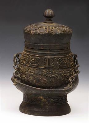 Lot 325 - A Chinese bronze archaic style vase and cover