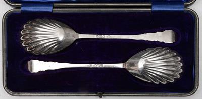 Lot 365 - A pair of silver shell spoons