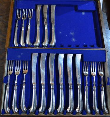 Lot 372 - A part set of nine silver plated fruit knives and forks