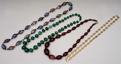 Lot 403 - A string of graduated malachite beads