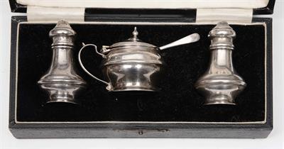 Lot 405 - A three piece silver cruet set