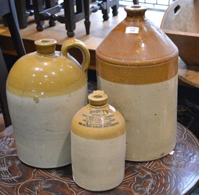 Lot 418 - A collection of three old stoneware cider barrels