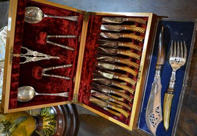 Lot 448 - A cased set of bone handled tea knives and forks