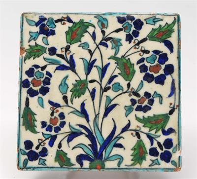 Lot 77 - AN ISLAMIC POLYCHROME TILE decorated in the Iznik style