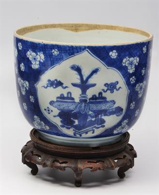 Lot 92 - A LARGE CHINESE BLUE AND WHITE BOWL with reserve panels and prunus decoration