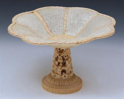 Lot 122 - A CHINESE CANTON IVORY TAZZA with intricately carved panel sides