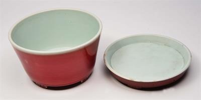 Lot 132 - A CHINESE SANG DE BOEUF JARDINIERE and stand