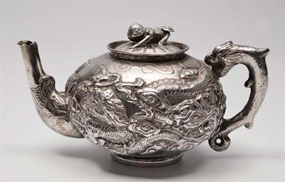 Lot 136 - A CHINESE SILVER TEAPOT with embossed dragon design and handle