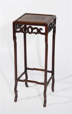 Lot 193 - A CHINESE HARDWOOD URN STAND with square top and carved frieze