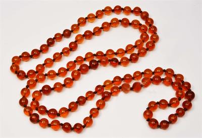 Lot 195 - AN AMBER BEAD NECKLACE with 108 beads