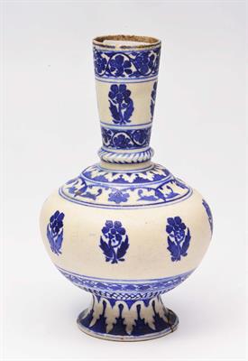 Lot 221 - A PERSIAN UNDERGLAZE BLUE BOTTLE VASE with simple flower and leaf designs