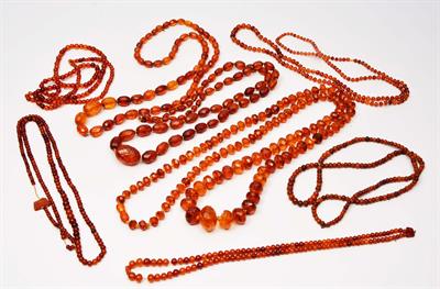 Lot 229 - A COLLECTION OF AMBER BEAD NECKLACES and loose amber beads