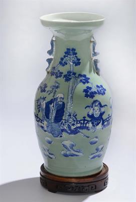 Lot 232 - A CHINESE CELADON GROUND BALUSTER VASE with Lao Tzu and other figures decorated in blue and white in