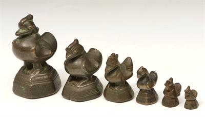 Lot 294 - A SET OF SIX GRADUATED BURMESE BRONZE OPIUM WEIGHTS