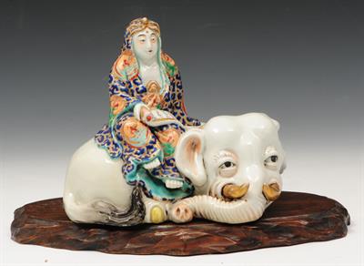 Lot 300 - A JAPANESE KUTANI PORCELAIN MODEL of a figure reading a hand scroll