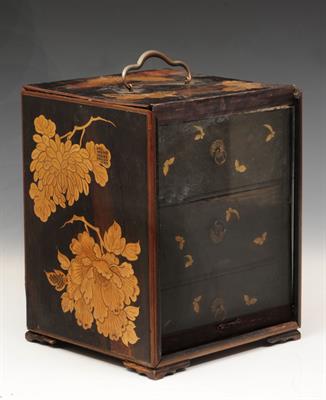 Lot 327 - A JAPANESE LACQUER SMALL BOX with three drawers and sliding glazed front with gold chrysanthemum and