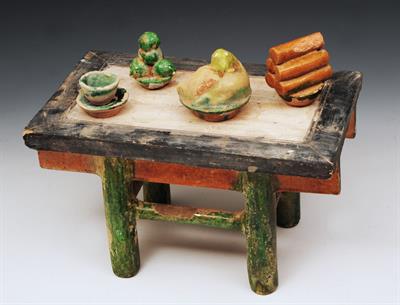 Lot 386 - AN ALTAR TABLE and four glazed pottery offerings/vessels