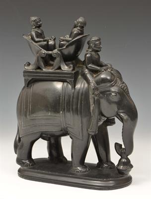 Lot 449 - AN INDIAN BASALT MODEL of an elephant with howdah