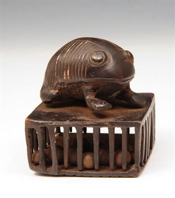 Lot 469 - A SOUTH EAST ASIAN BRONZE  RATTLE in the form of a beetle on a cage