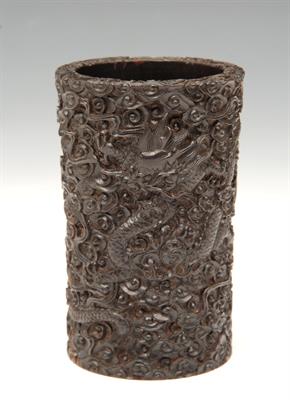 Lot 489 - A CHINESE HUANGHUALI BRUSH POT of slender cylindrical form finely carved two dragons guarding sacred