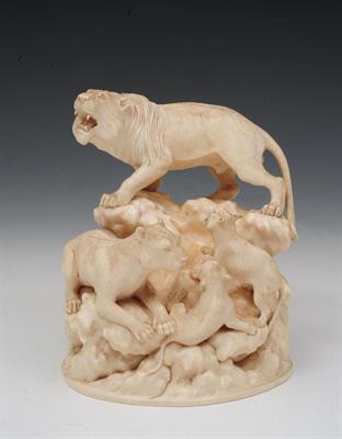 Lot 492 - A JAPANESE IVORY GROUP of a pride of lions represented by parents and two cubs