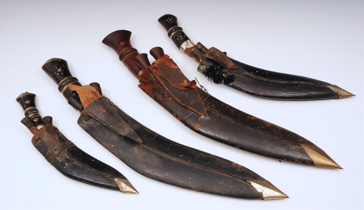 Lot 503 - A COLLECTION OF FOUR KUKRI with scabbards