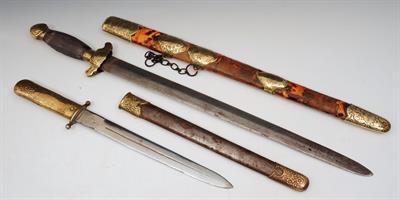 Lot 504 - A CHINESE SHORT SWORD with tortoiseshell and brass mounted scabbard engraved with bats and Shou