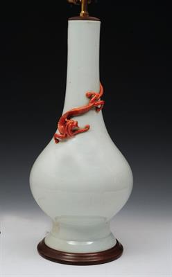 Lot 517 - A CHINESE WHITE GLAZED PORCELAIN BOTTLE VASE of inverted baluster form decorated  around the neck